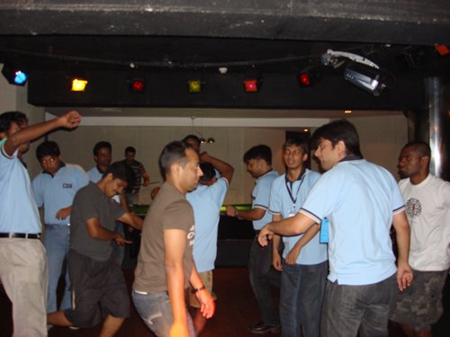 People dancing in a hall.